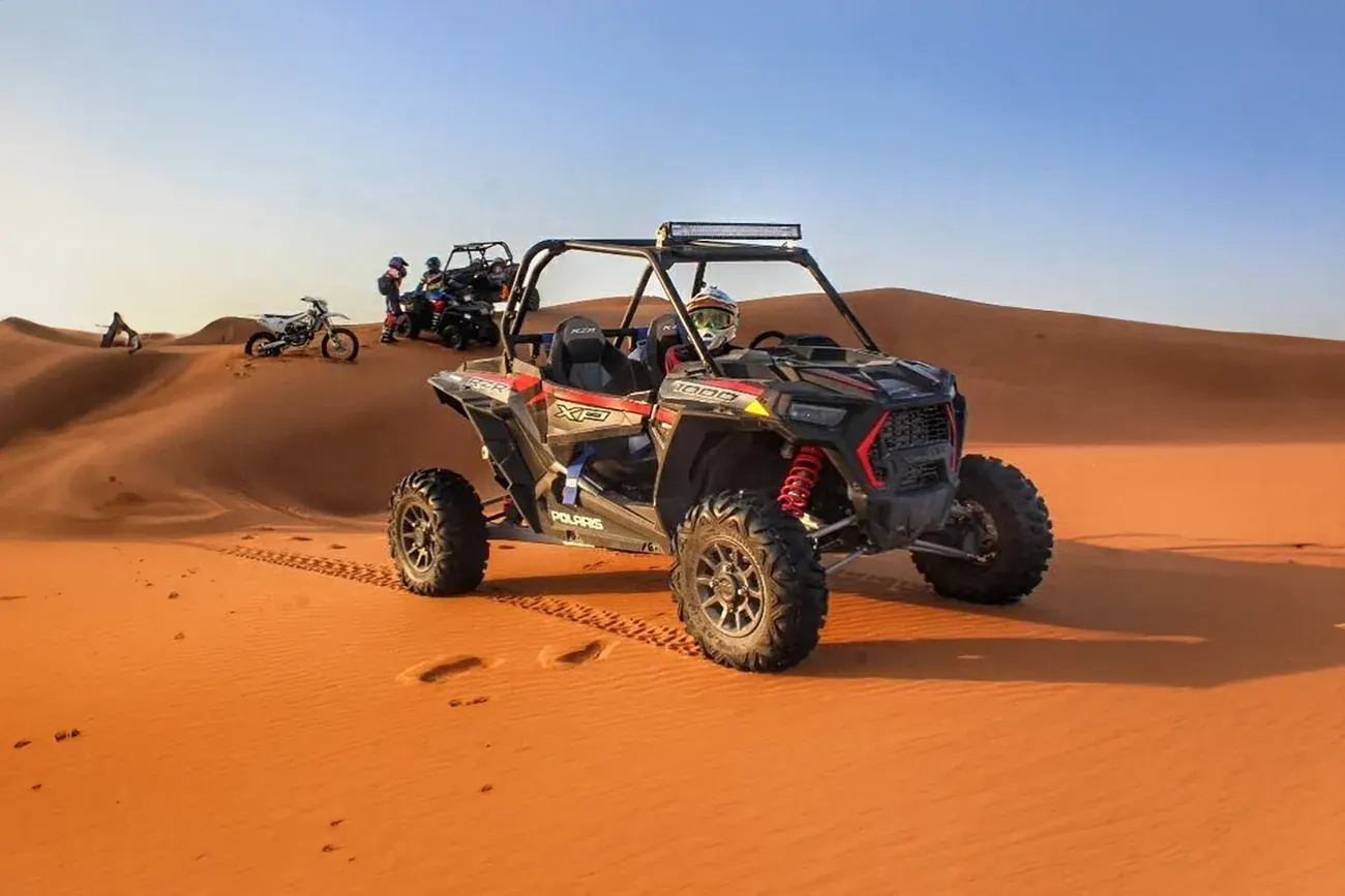 Dune buggies on the red dunes of Dubai